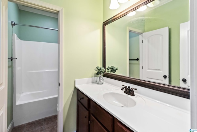 bathroom with vanity, bathtub / shower combination, and tile patterned flooring