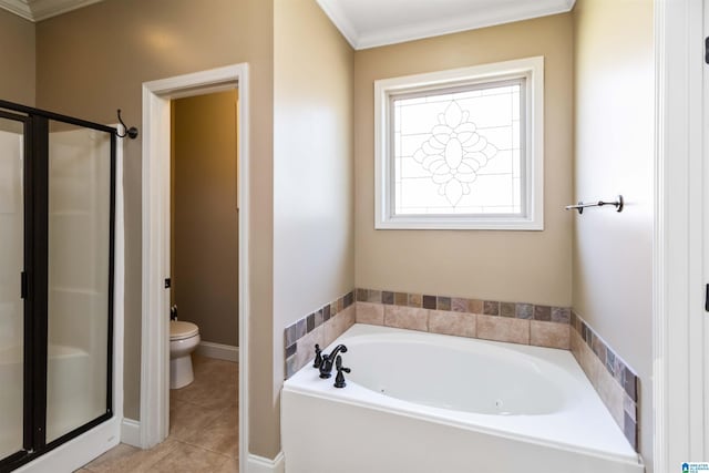 bathroom with ornamental molding, toilet, a shower stall, tile patterned floors, and a garden tub