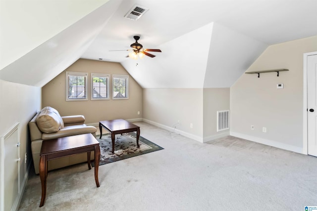 additional living space featuring visible vents, light colored carpet, a ceiling fan, and lofted ceiling