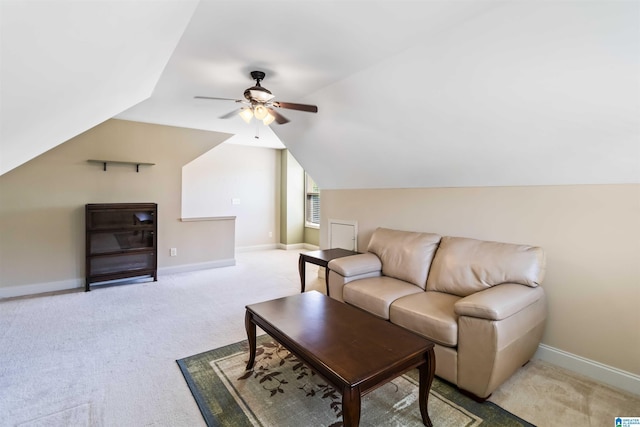 living room with light colored carpet, baseboards, a ceiling fan, and lofted ceiling