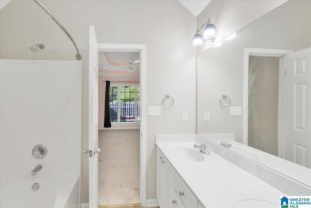 full bathroom featuring a sink, double vanity, bathing tub / shower combination, and a ceiling fan