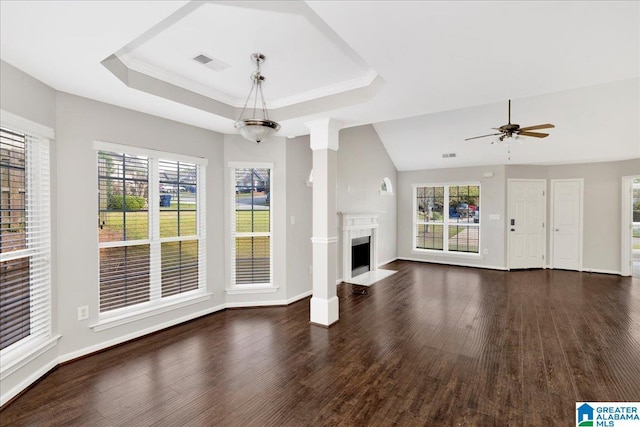 unfurnished living room featuring a premium fireplace, ceiling fan, dark wood-style floors, and visible vents