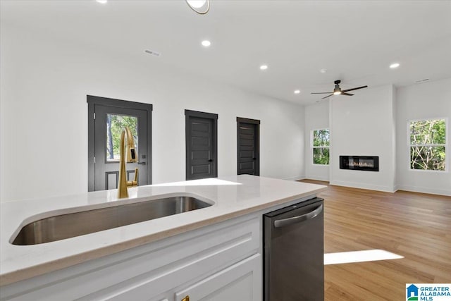 400 Ingram Ave W, Oneonta, AL 35121 - kitchen with recessed lighting, light stone counters, plenty of natural light, and dishwasher