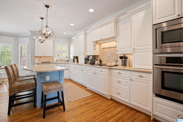 kitchen with white cabinets and a breakfast bar area