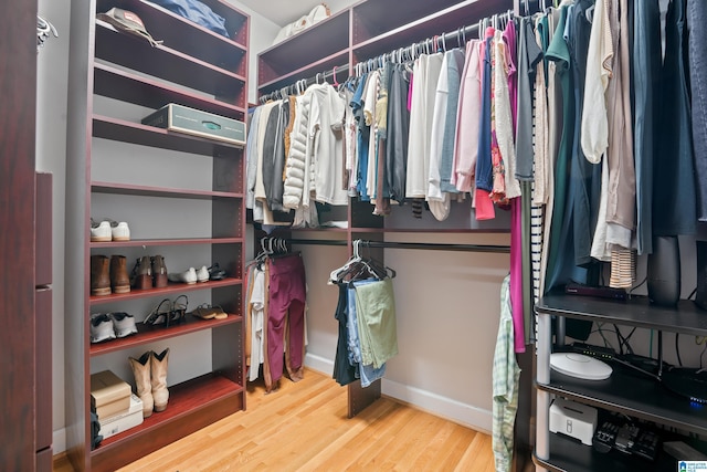 spacious closet featuring wood finished floors