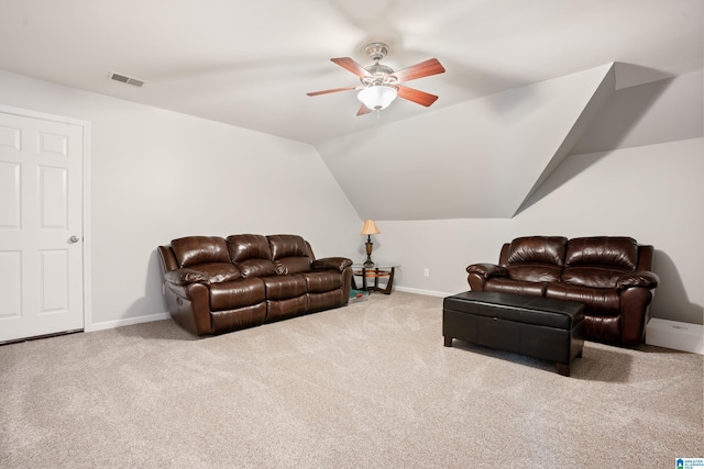 carpeted living room featuring lofted ceiling, a ceiling fan, visible vents, and baseboards