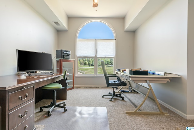 carpeted home office featuring visible vents and baseboards