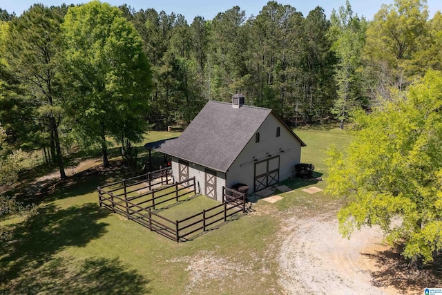 bird's eye view featuring a forest view