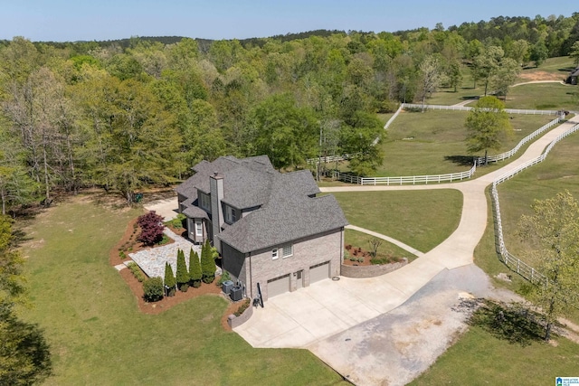 aerial view featuring a wooded view