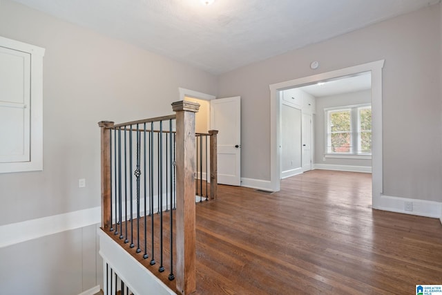 686 Ridge Top Cir, Birmingham, AL 35206 - hallway with wood finished floors, visible vents, baseboards, and an upstairs landing