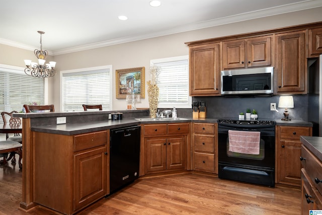 7717 Clayton Cove Pkwy, Clay, AL 35126 - kitchen with a peninsula, dark countertops, and black appliances