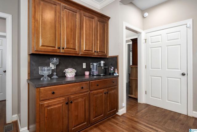7717 Clayton Cove Pkwy, Clay, AL 35126 - bar with tasteful backsplash, dark wood-style flooring, baseboards, and visible vents