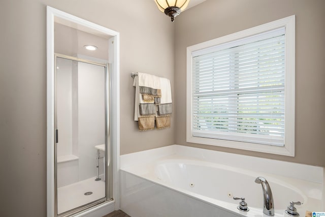 7717 Clayton Cove Pkwy, Clay, AL 35126 - full bathroom featuring a shower stall and a jetted tub