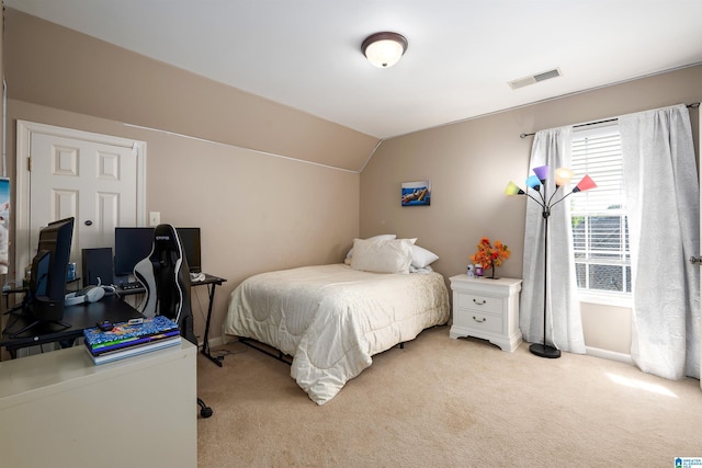 7717 Clayton Cove Pkwy, Clay, AL 35126 - bedroom with light carpet, visible vents, and vaulted ceiling