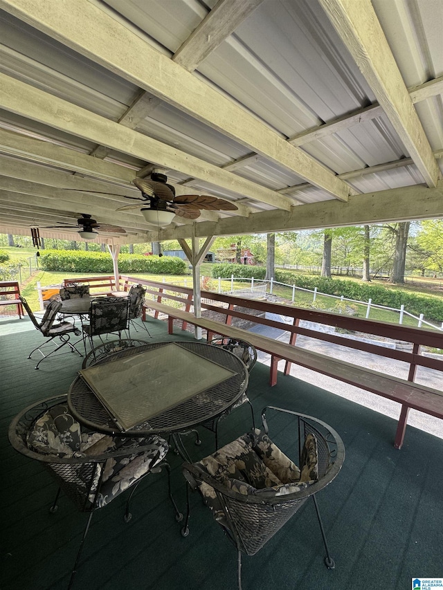 wooden deck featuring a ceiling fan and outdoor dining area