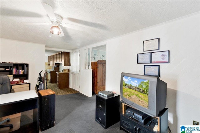 home office featuring dark carpet, a textured ceiling, and ceiling fan