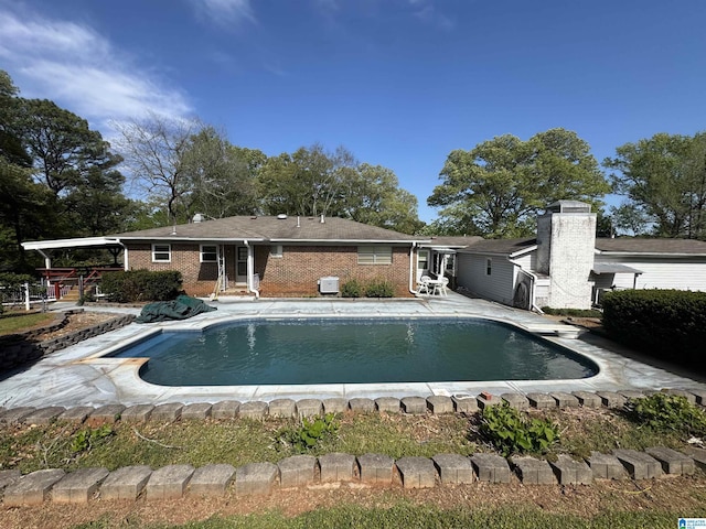 outdoor pool featuring a patio