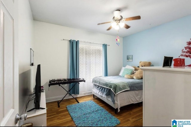 bedroom with a ceiling fan and wood finished floors