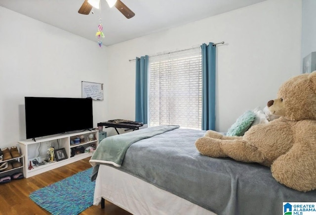 bedroom with ceiling fan and wood finished floors