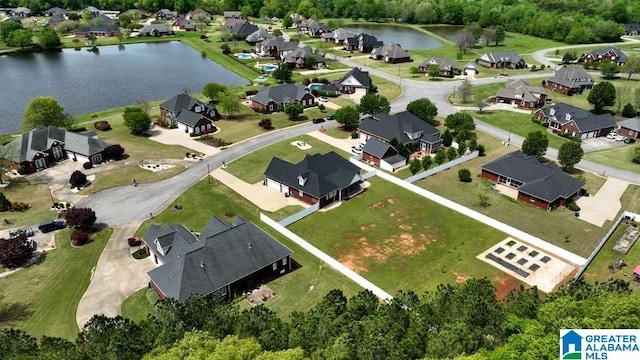 aerial view featuring a residential view and a water view