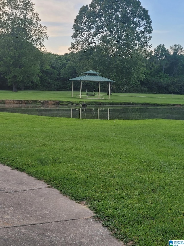 view of community featuring a yard and a gazebo