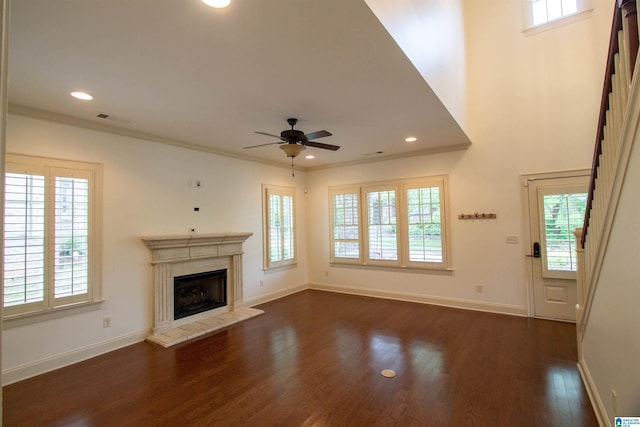 3881 Ross Park Dr, Hoover, AL 35226 - unfurnished living room featuring a ceiling fan, stairs, a fireplace with raised hearth, visible vents, and dark wood-style floors