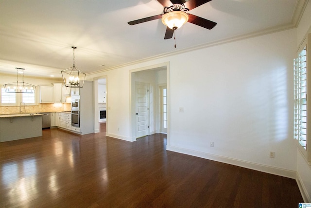 3881 Ross Park Dr, Hoover, AL 35226 - interior space with a sink, dark wood-style flooring, baseboards, ceiling fan with notable chandelier, and crown molding