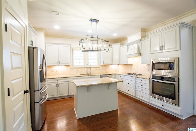 3881 Ross Park Dr, Hoover, AL 35226 - kitchen with a sink, an inviting chandelier, appliances with stainless steel finishes, ornamental molding, and a kitchen island