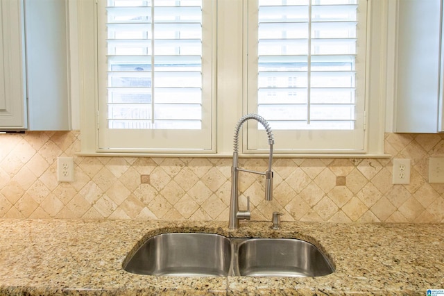 3881 Ross Park Dr, Hoover, AL 35226 - kitchen featuring backsplash, light stone countertops, a sink, and white cabinets