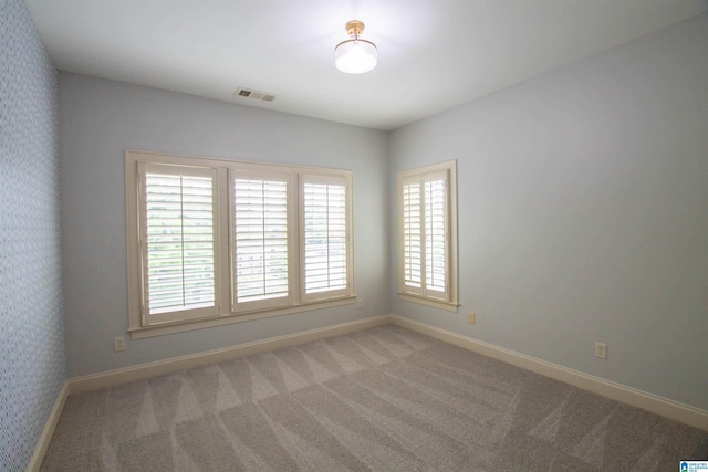 3881 Ross Park Dr, Hoover, AL 35226 - empty room with baseboards, wallpapered walls, visible vents, and carpet