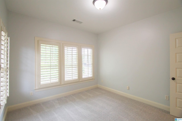 3881 Ross Park Dr, Hoover, AL 35226 - spare room featuring baseboards, visible vents, and light carpet