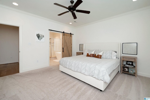 bedroom with ornamental molding, recessed lighting, carpet flooring, and a barn door