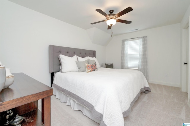 bedroom with baseboards, visible vents, light carpet, and ceiling fan