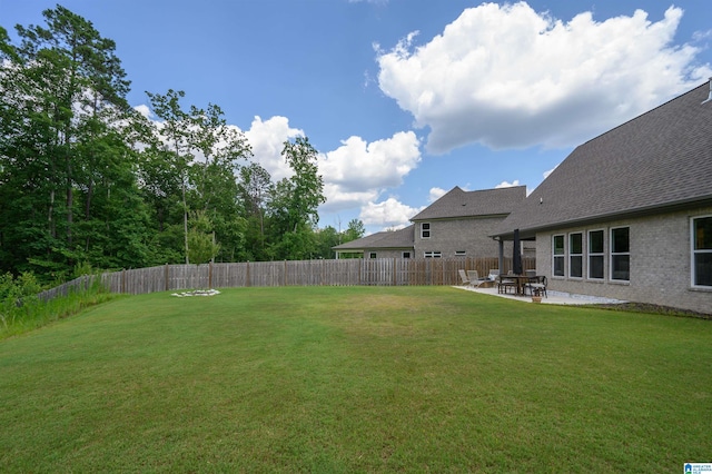 view of yard featuring a fenced backyard and a patio area