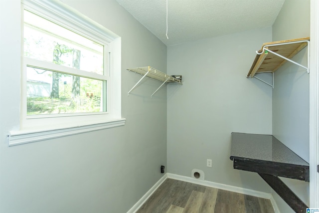 122 Mims Cir, Clanton, AL 35045 - laundry area with hookup for an electric dryer, wood finished floors, and a textured ceiling