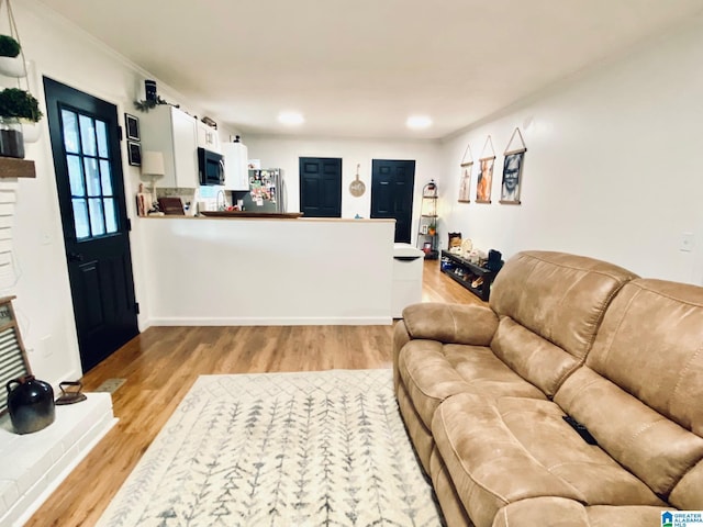 living room featuring recessed lighting and light wood-style floors