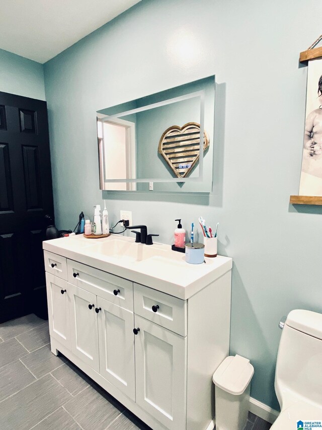 half bath with vanity and toilet