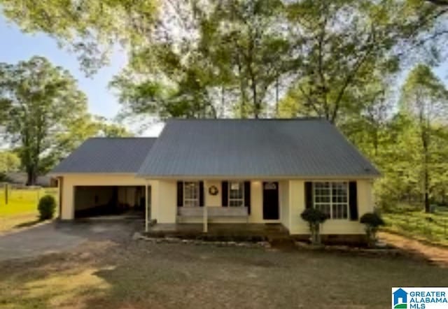 54 Setter Dr, Anniston, AL 36207 - view of front of home with a porch, driveway, and a garage