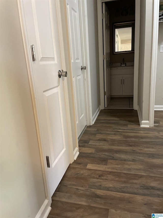 54 Setter Dr, Anniston, AL 36207 - corridor featuring dark wood-style flooring, baseboards, and a sink