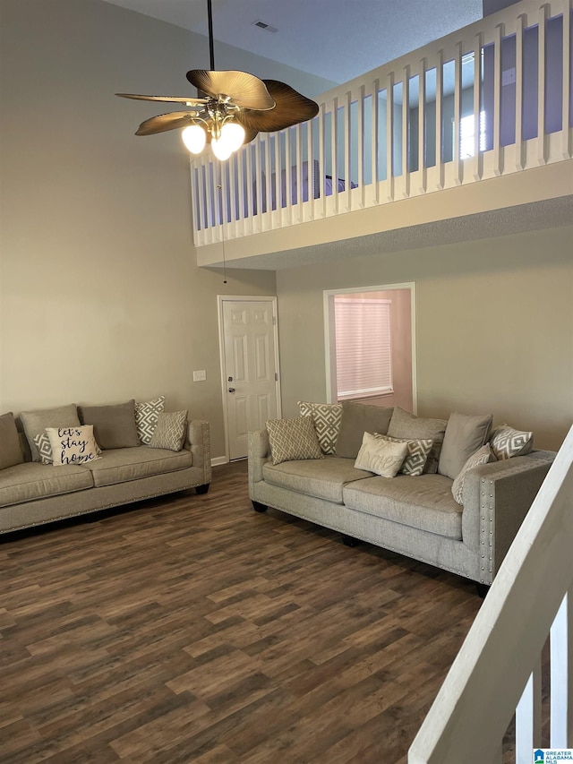 54 Setter Dr, Anniston, AL 36207 - living area featuring a high ceiling, a ceiling fan, dark wood-type flooring, and baseboards