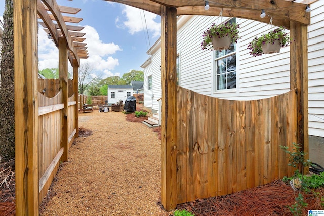 view of side of home with fence