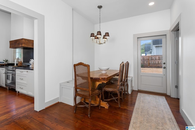 dining space with baseboards, a chandelier, recessed lighting, and dark wood-type flooring