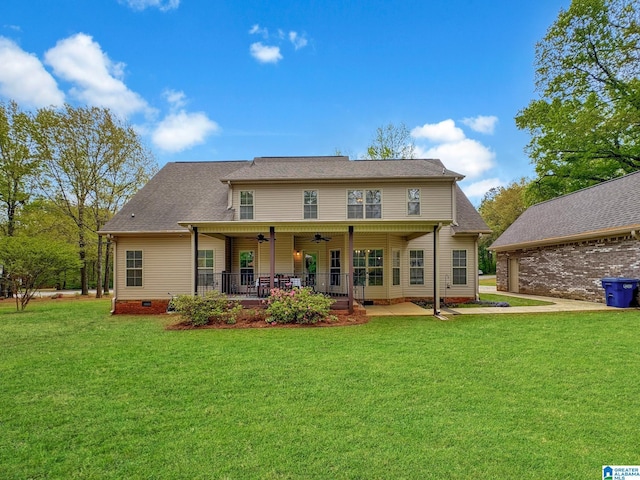 back of house with crawl space, a patio area, a shingled roof, a yard, and ceiling fan