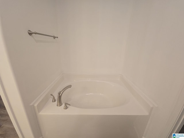 full bathroom with a garden tub