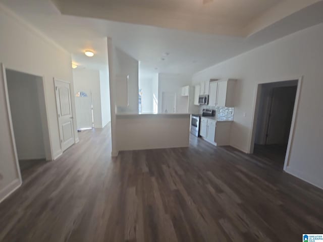 unfurnished living room with dark wood-style flooring