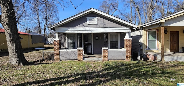 18 6th Ave S, Birmingham, AL 35205 - view of front facade with a porch and a front lawn