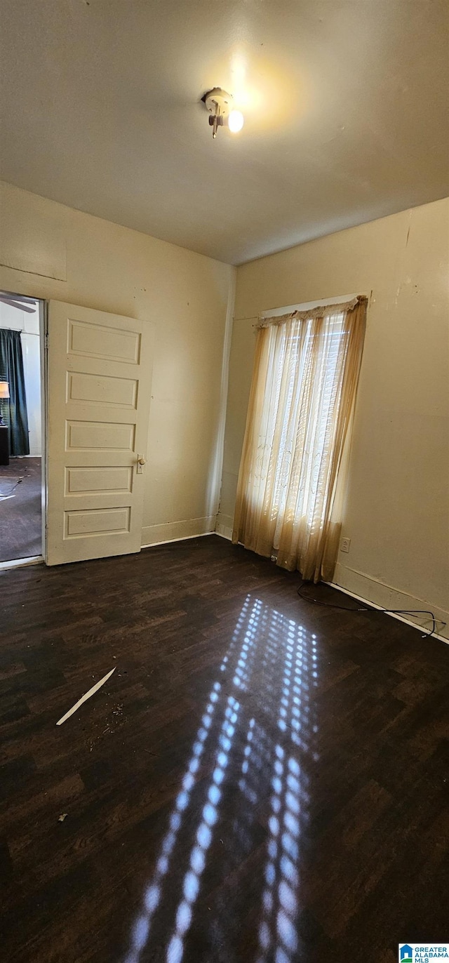 18 6th Ave S, Birmingham, AL 35205 - spare room with baseboards and wood finished floors