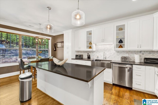2092 Grey Oaks Ter, Pelham, AL 35124 - kitchen featuring decorative backsplash, stainless steel dishwasher, dark countertops, and a sink