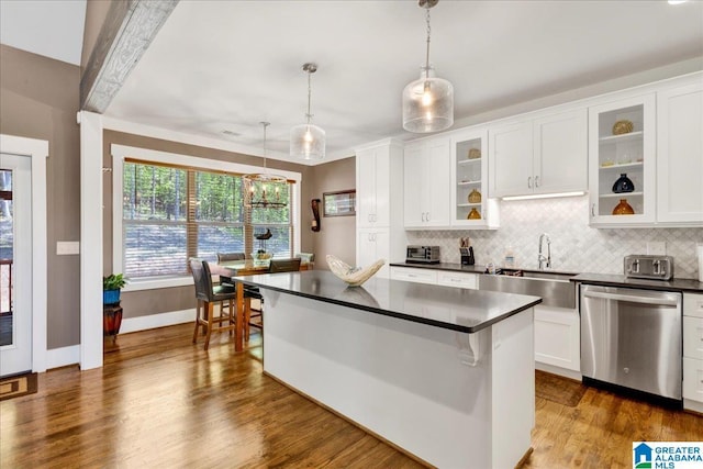2092 Grey Oaks Ter, Pelham, AL 35124 - kitchen with dark countertops, a sink, decorative backsplash, dishwasher, and white cabinetry