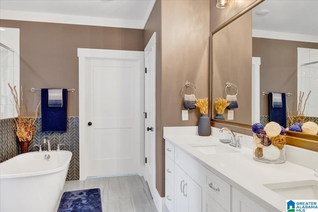 2092 Grey Oaks Ter, Pelham, AL 35124 - full bathroom with a soaking tub, a wainscoted wall, a sink, double vanity, and tile walls